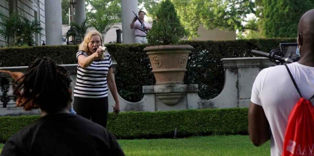 FILE PHOTO A Picture and its Story U S couple waves guns at anti racism protesters 1595322524419
