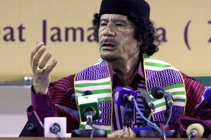 libya leader muammar gaddafi wearing an african tribal outfit attends the opening session of the forum of traditional kings sultans princes and sheikhs of tribes in africa in benghazi