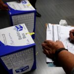 election officials seal ballot boxes at the end of voting in south africa's parliamentary and provincial elections at a polling station in johannesburg