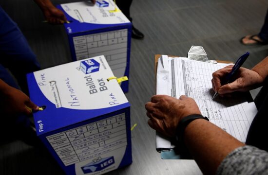 election officials seal ballot boxes at the end of voting in south africa's parliamentary and provincial elections at a polling station in johannesburg