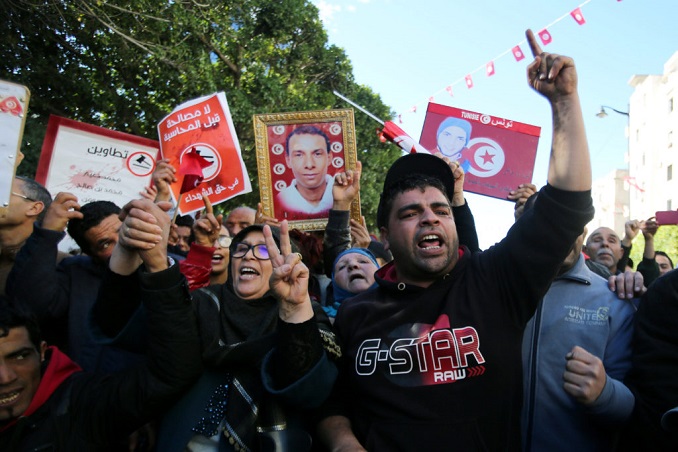 people attend demonstrations on the seventh anniversary of the toppling of president zine el abidine ben ali, in tunis