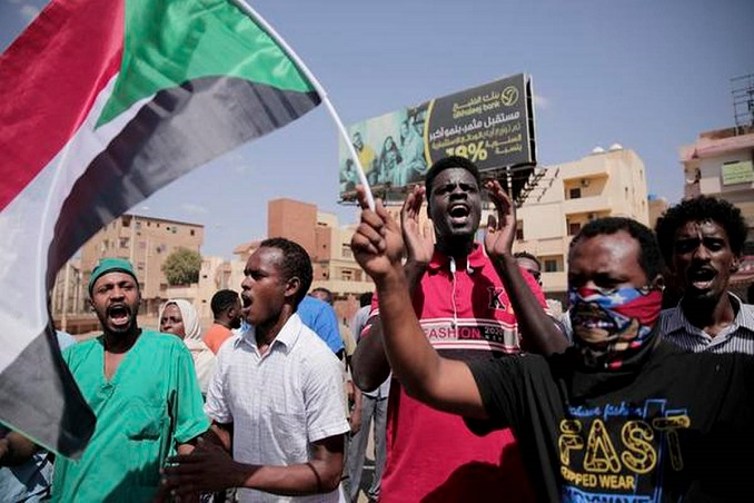 protesters march into the streets of khartoum causing clashes