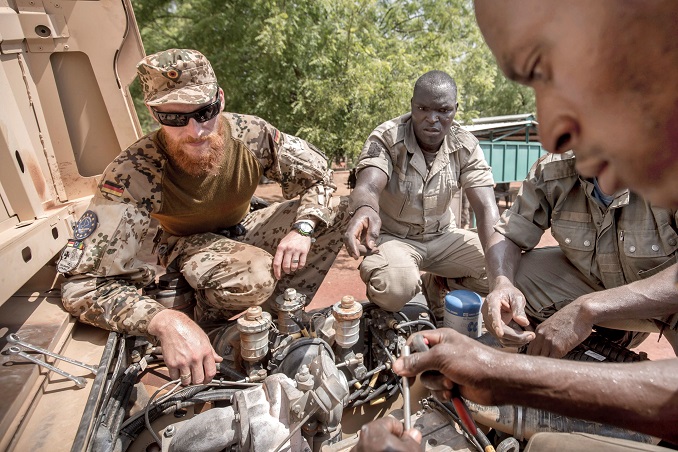 file photo: a german army bundeswehr instructor speaks to mali soldiers during a car repair training at the eutm military training mission in koulikoro