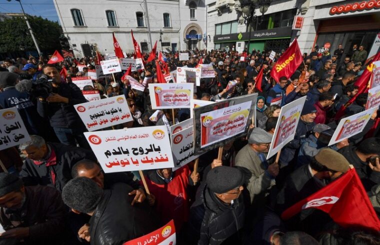 tunisians rally against the government with the ugtt labor union.