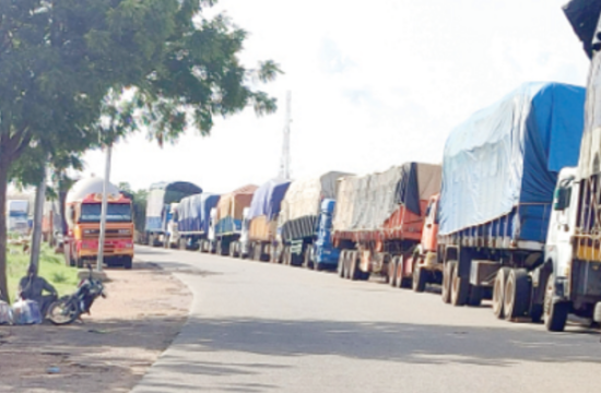 at the benin niger border hundreds of trucks are halted due to a coup