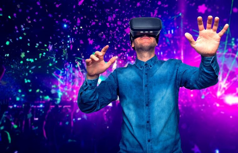 man wearing virtual reality goggles. concert background